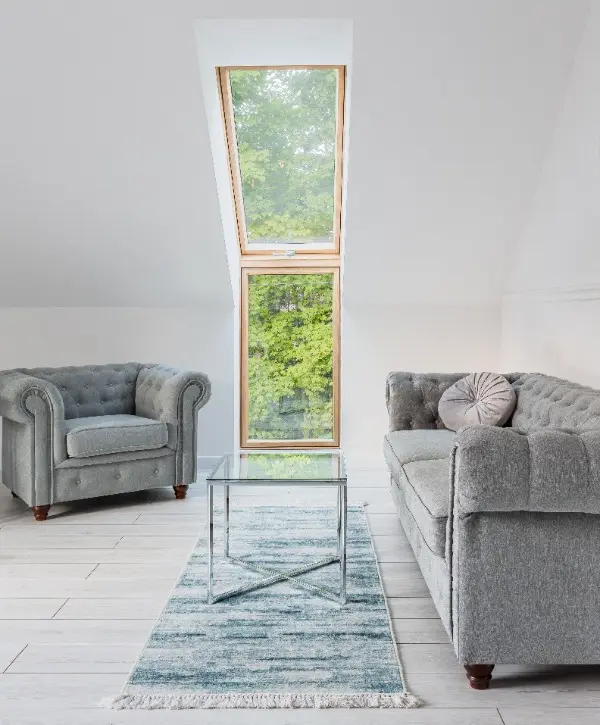 A cozy living room featuring a comfortable couch and a stylish table.
