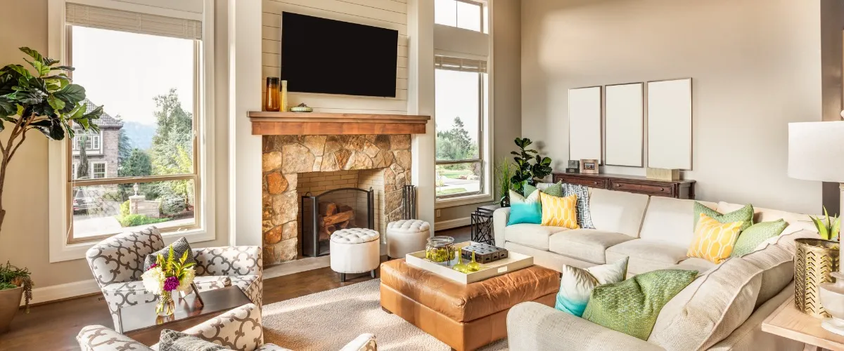 A cozy living room featuring a fireplace and comfortable couches arranged for relaxation and socializing.