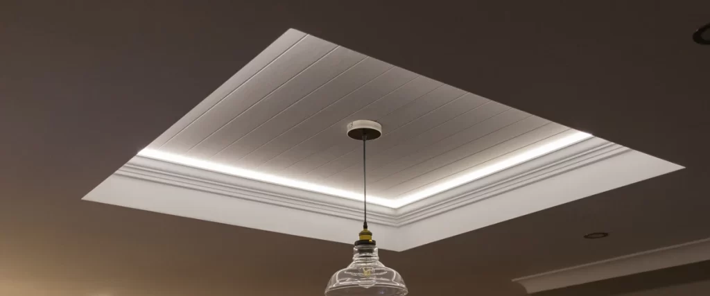 Versatile LED strips used along the edges of a ceiling tray to create a soft, colorful atmospheric glow.