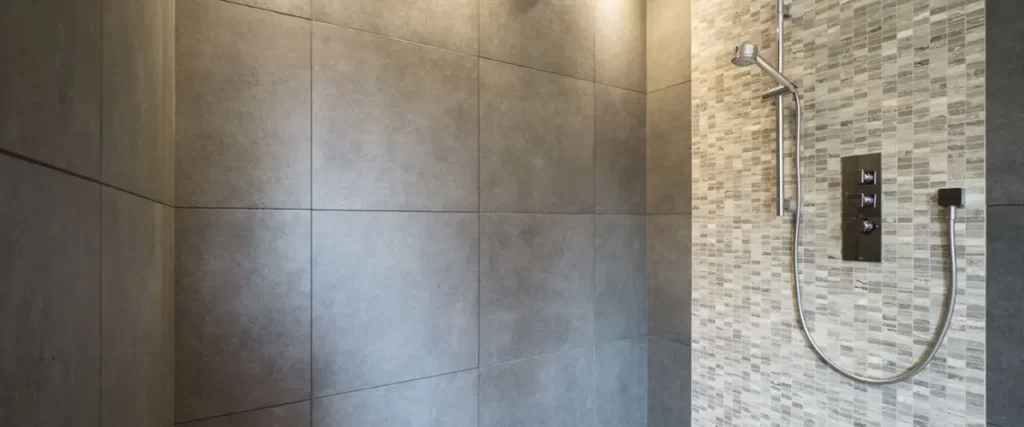Luxury tiled walk-in shower with rainfall showerhead and modern bathroom remodeling design